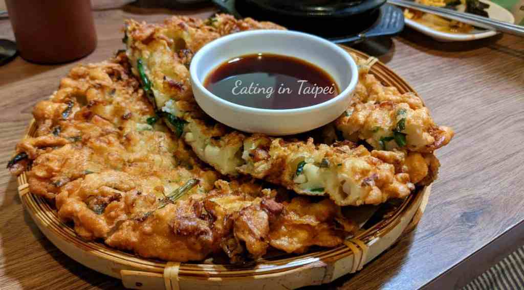 The Korean fried pancake is crunchy and looks incredible, but there's not much seafood inside.